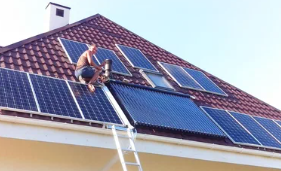 Residential rooftop solar array under bright sun