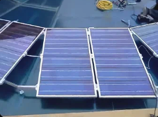 Technician configuring inverter and smart solar monitoring