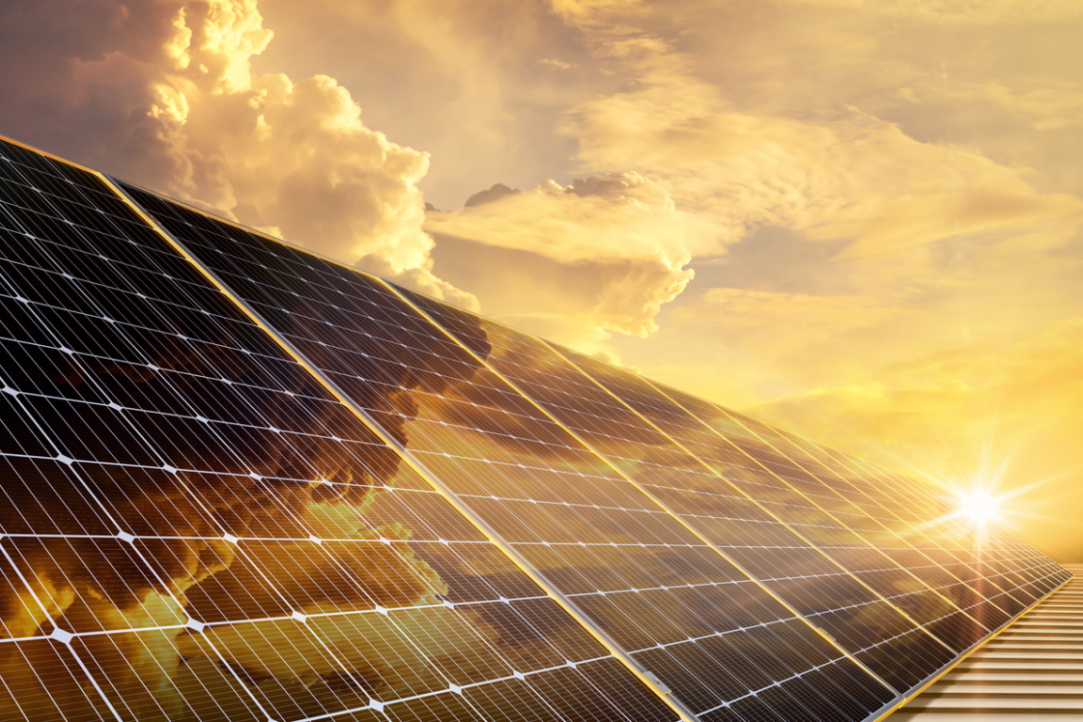 Solar energy specialists reviewing a photovoltaic installation plan